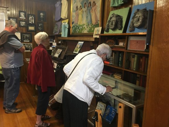 a guest looks at the doctor Allan Roy Dafoe display case